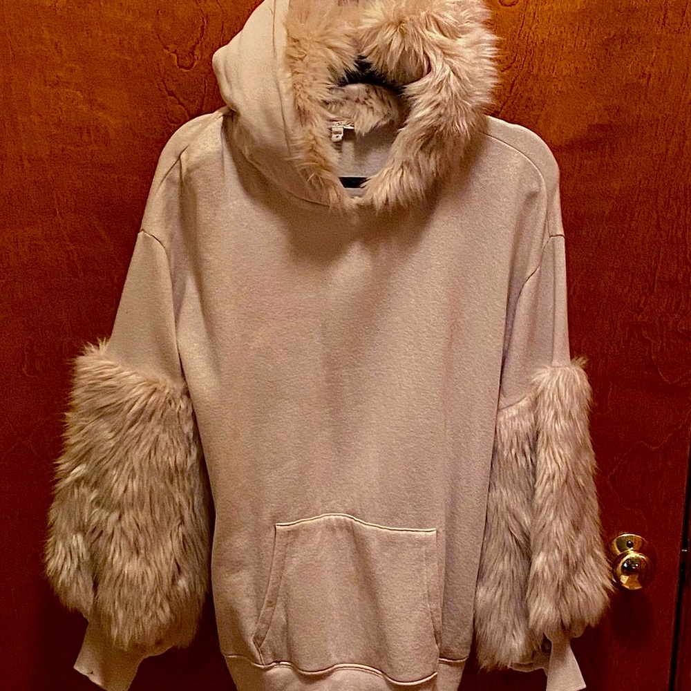 96%  18% polyester 4% spandex fur trimmed hoodie w fur trimmed sleeves.